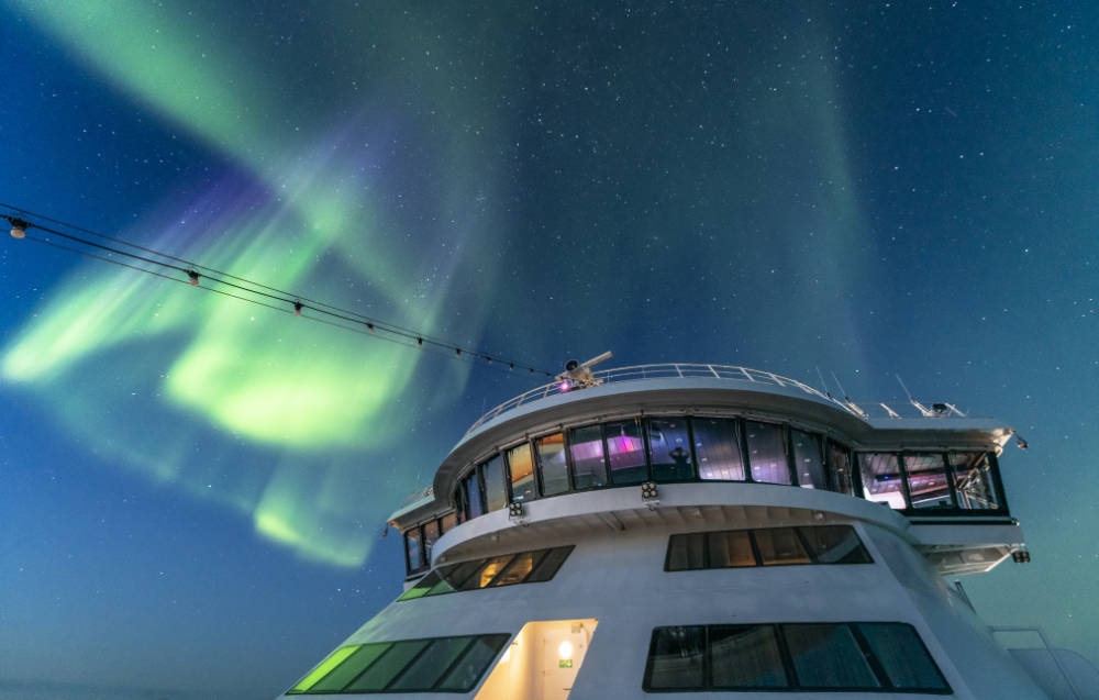 Nordlicht Versprechen bei Hurtigruten - Bildquelle: Karsten Bidstrup / Hurtigruten